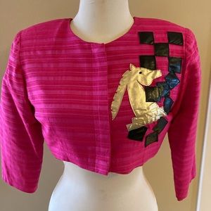 Vintage one of a kind, hand made silk cropped jacket with leather appliqués.